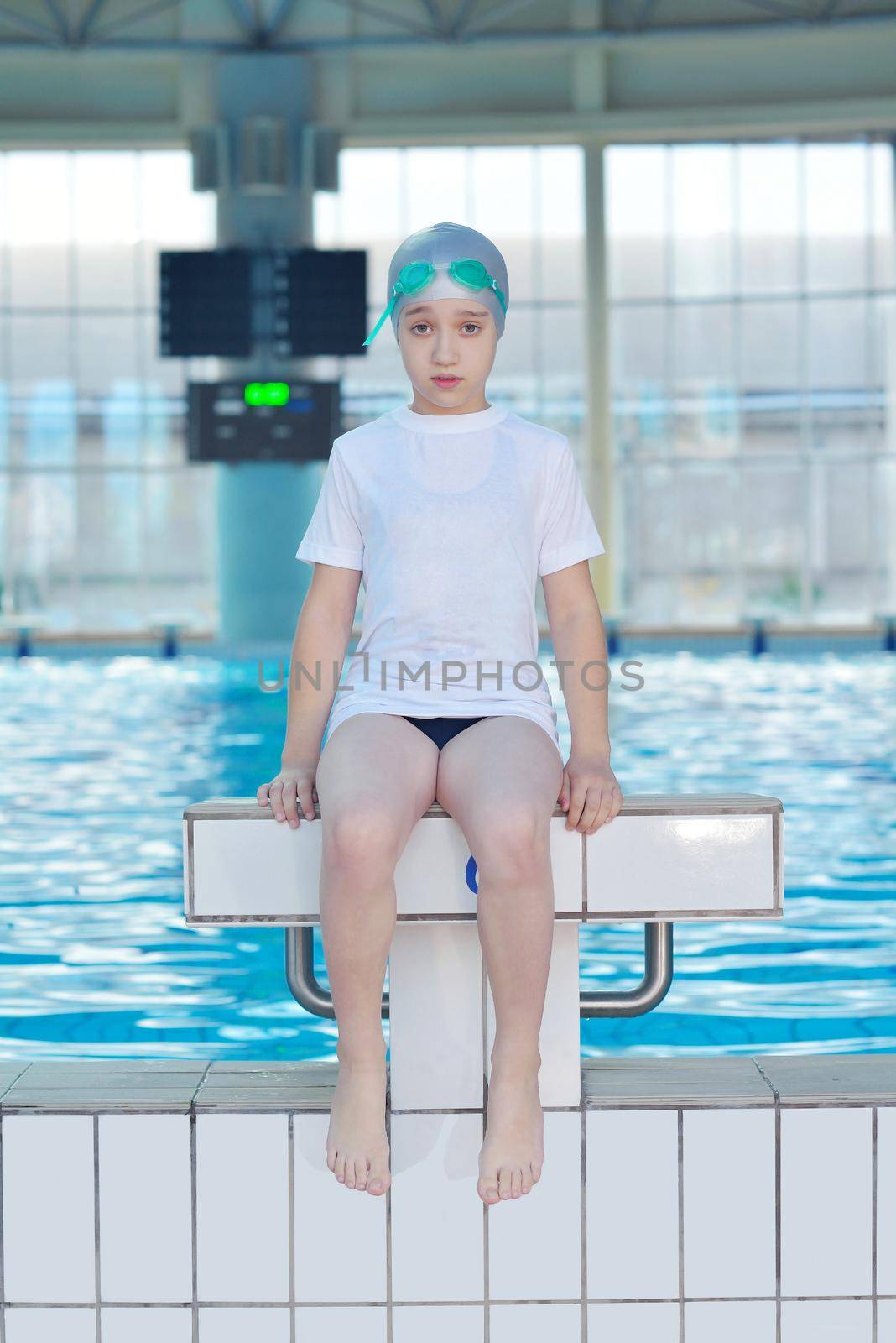 health and fitness lifestyle concept with young athlete swimmer recreating  on indoor olimpic pool