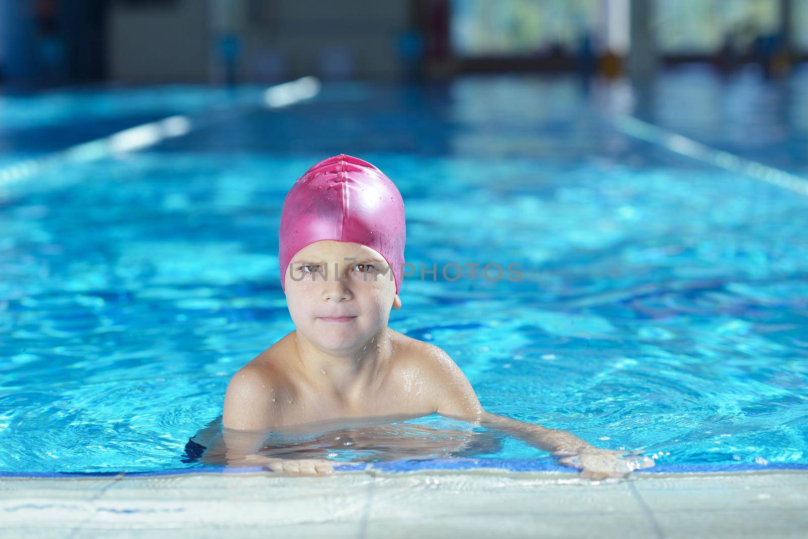 happy chid have fun on swimming pool