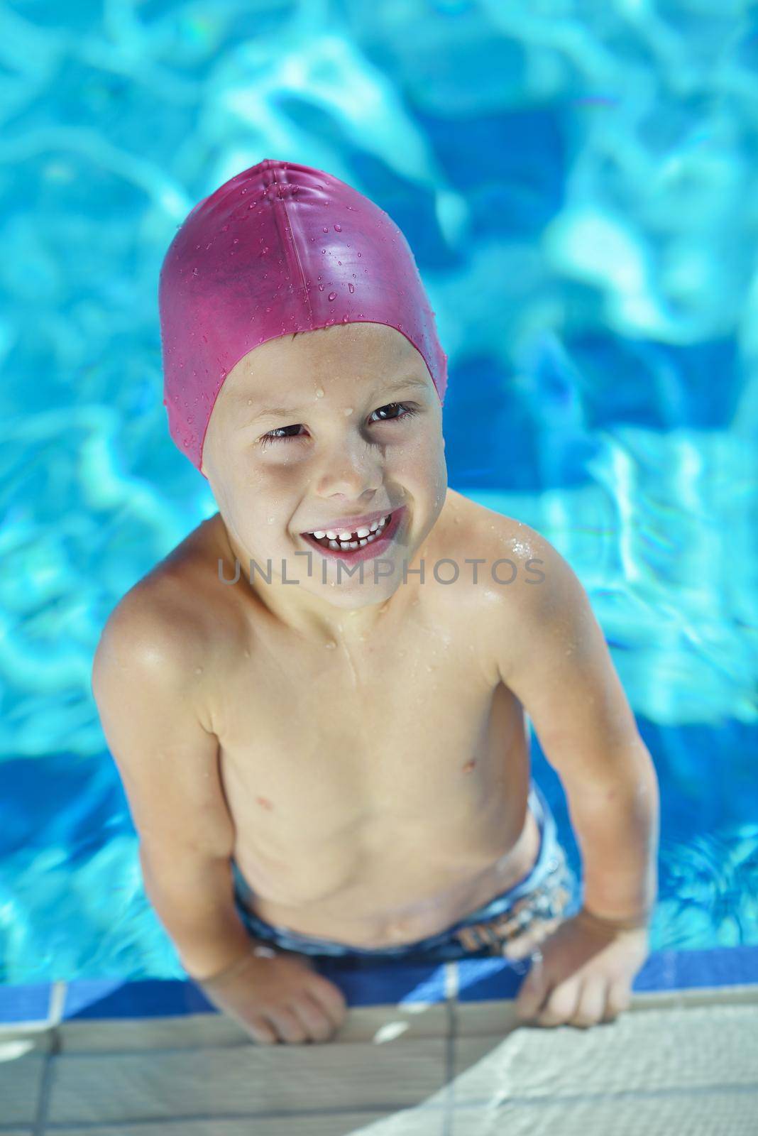 happy child on swimming pool by dotshock