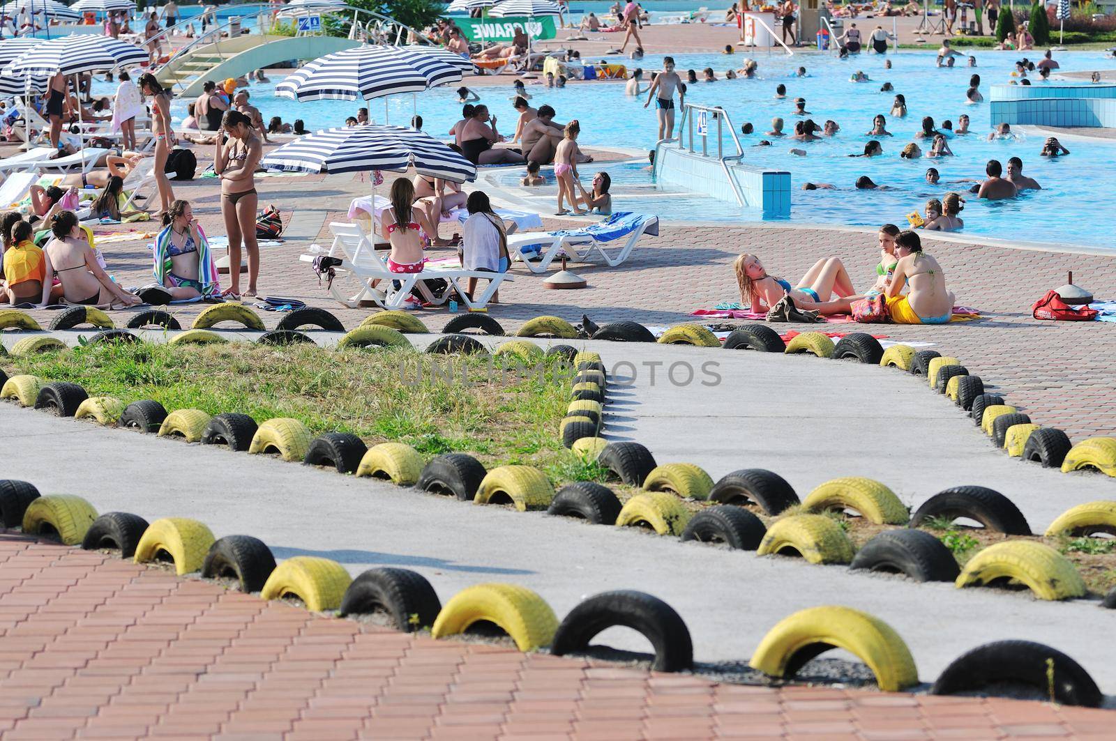 happy child have fun on water slike on outdoor swimming pool 