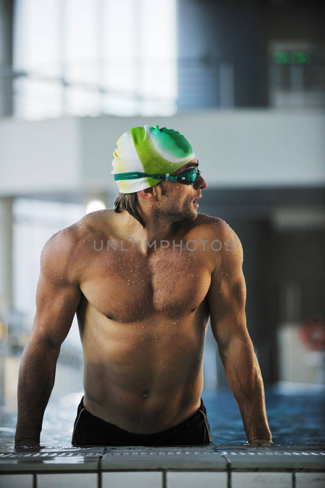 health and fitness lifestyle concept with young athlete swimmer recreating  on olimpic pool