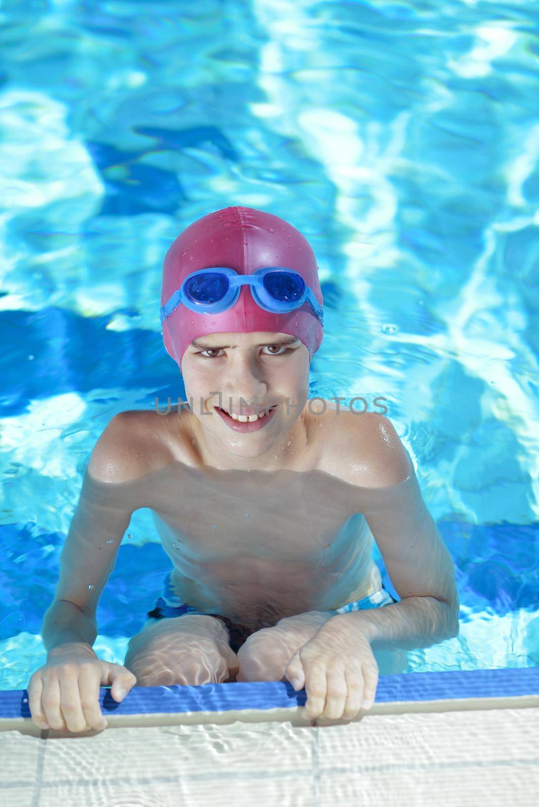 happy child on swimming pool by dotshock