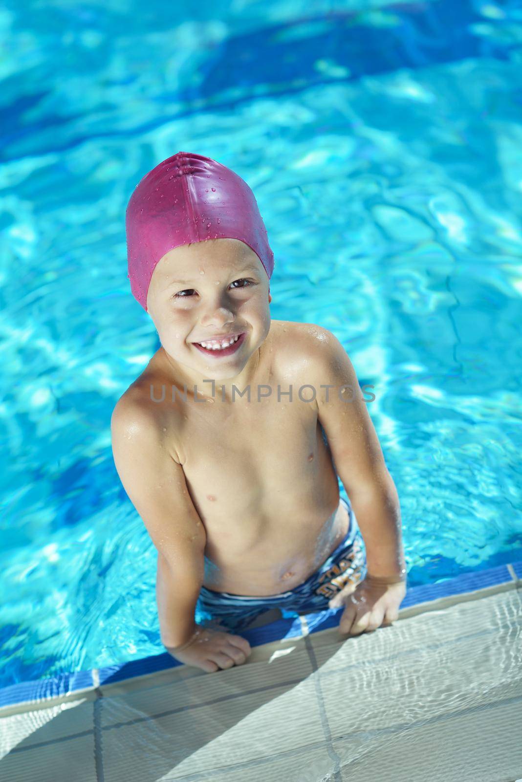 happy child on swimming pool by dotshock