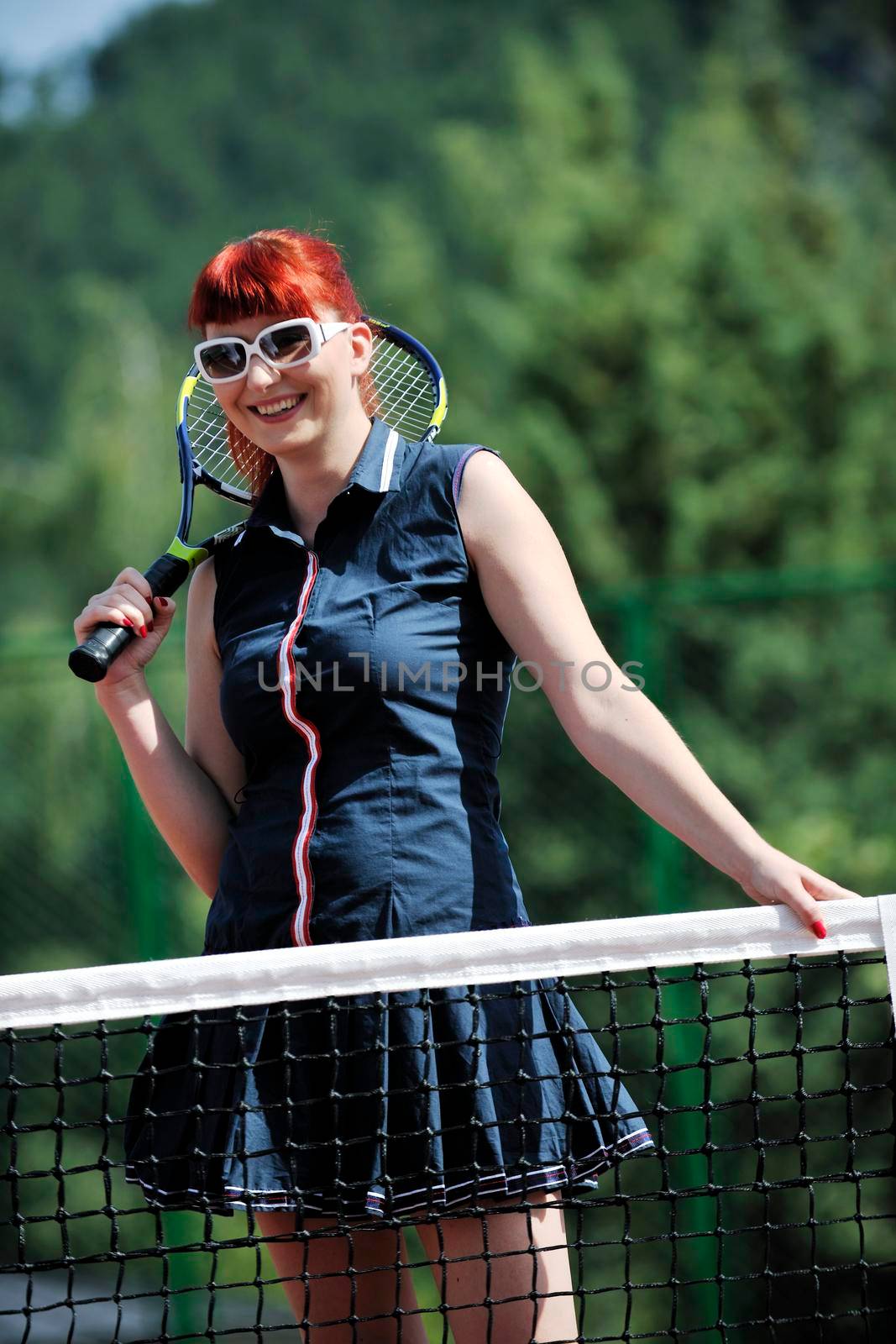 young woman play tennis game outdoor by dotshock