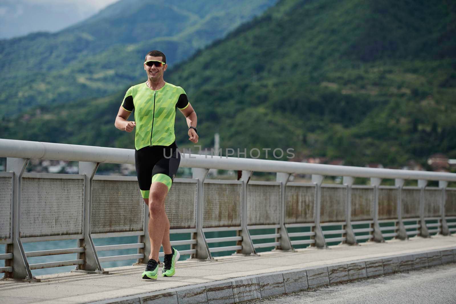 triathlon athlete running on street urban enviroment morning training workout