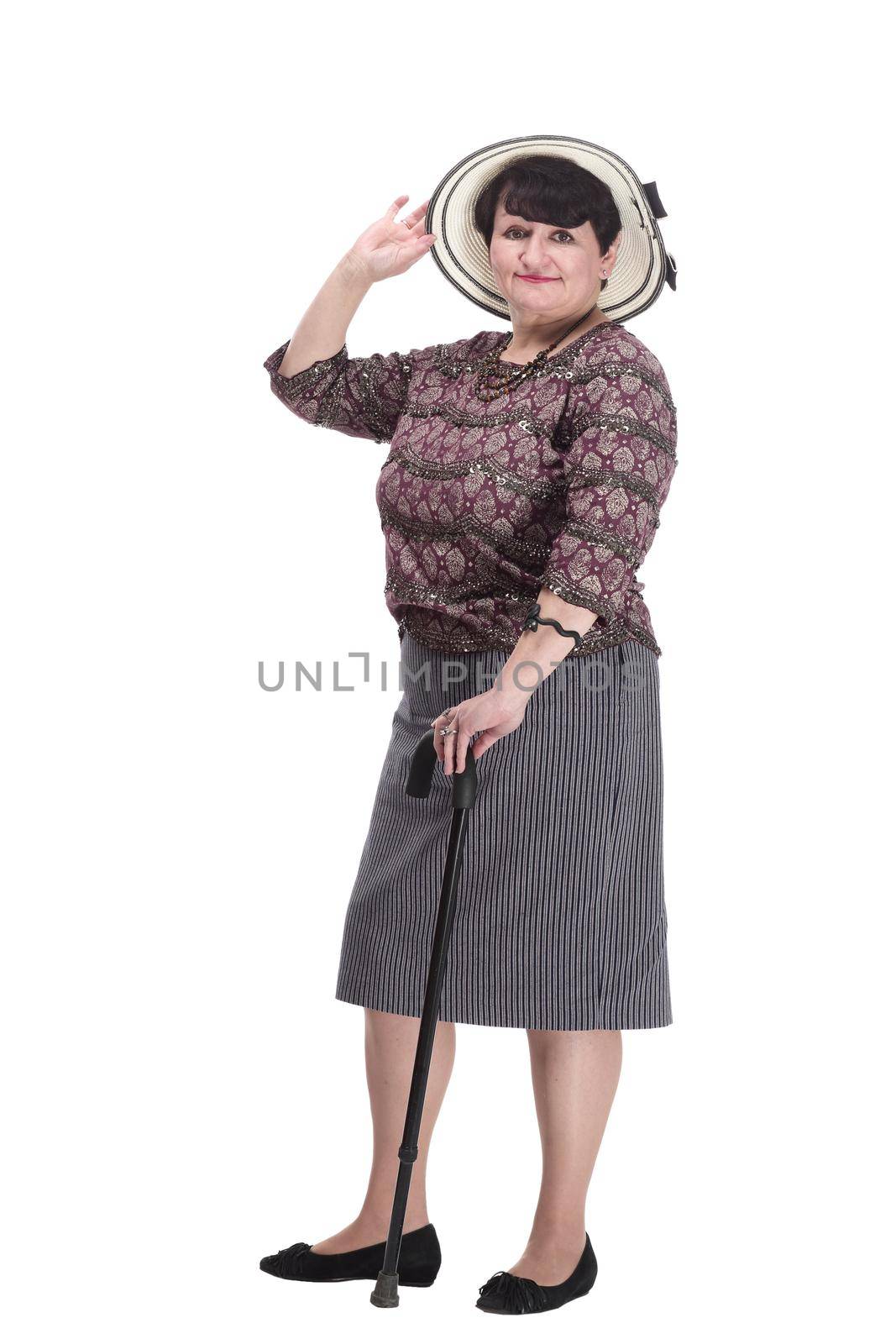 elderly woman with a walking stick in a summer hat. isolated on a white background.