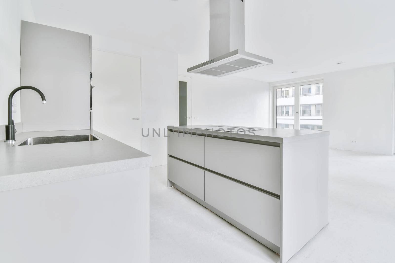 Snow-white kitchen area in a large elegant apartment