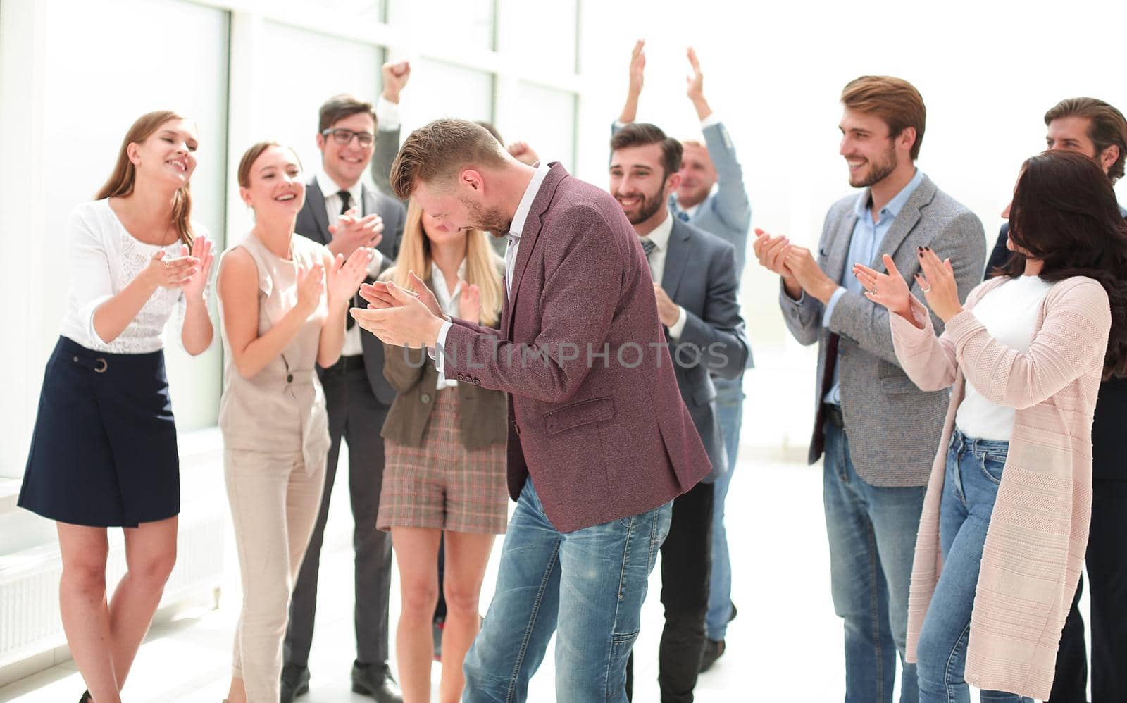 young businessman on the background of applauding business team. success concept
