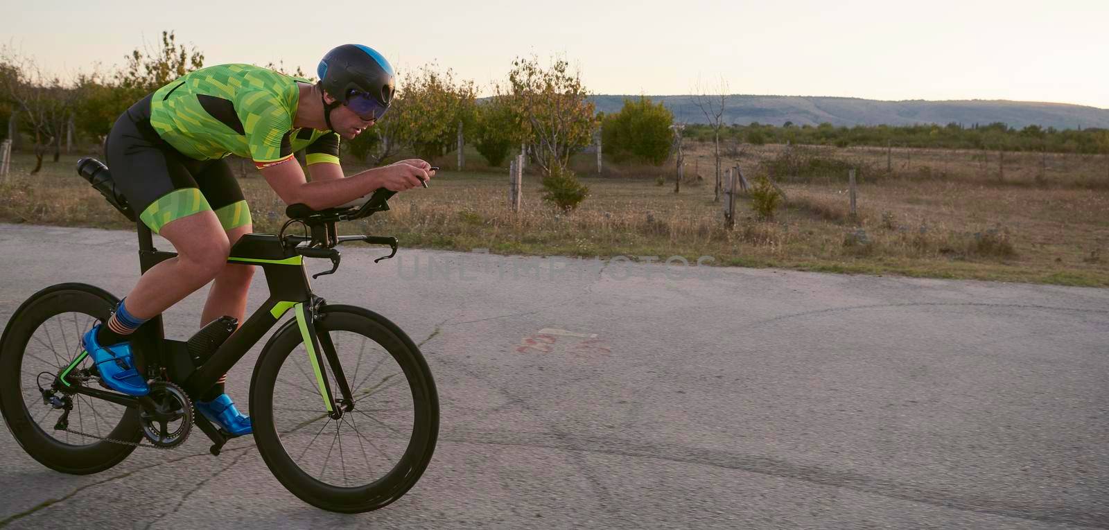 triathlon athlete riding a  bike by dotshock