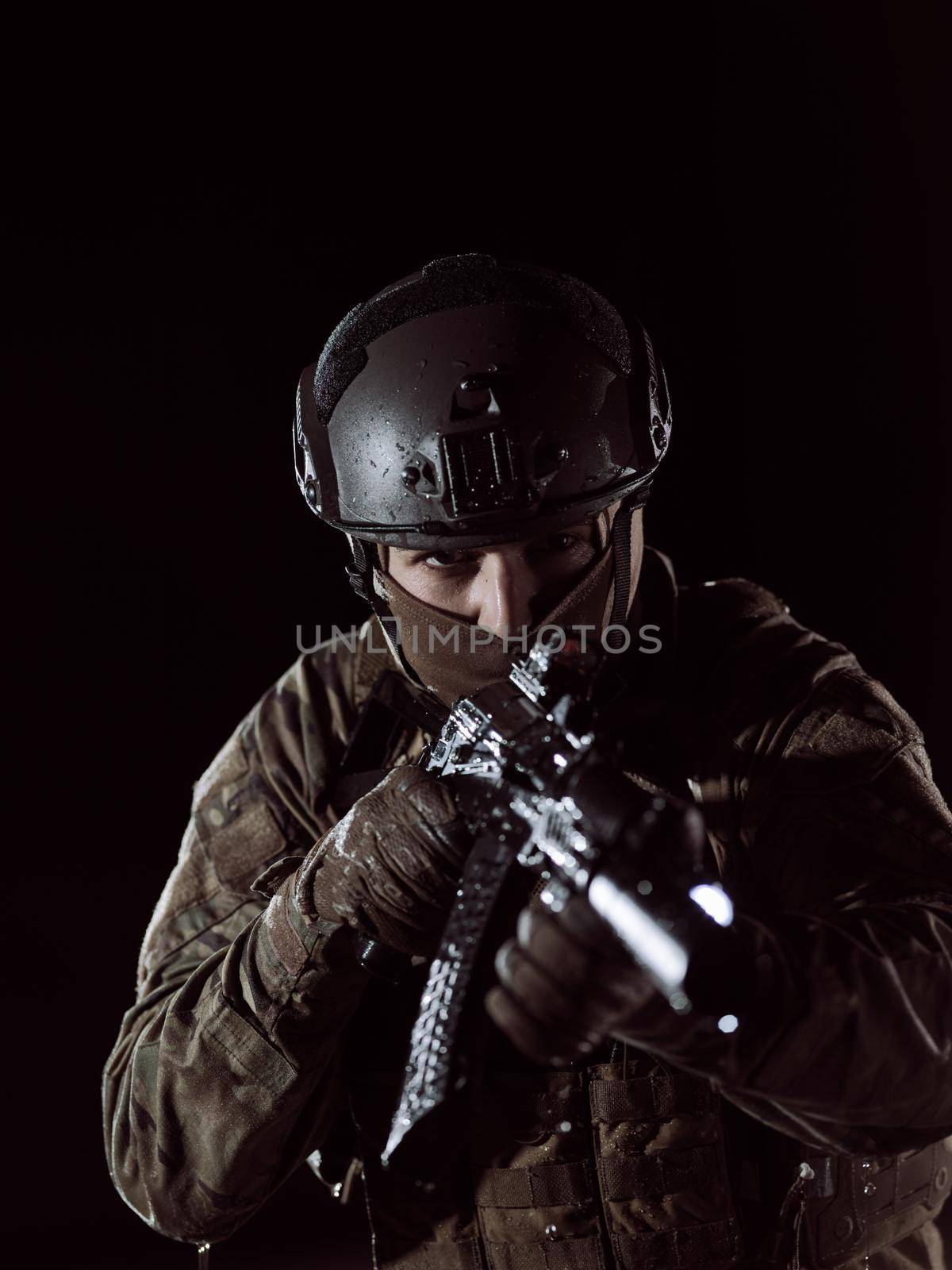 soldier with weapon and full military equioment  and combat gear in night mission