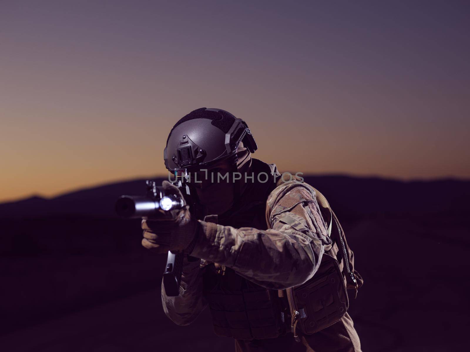 soldier with weapon and full military equioment  and combat gear in night mission