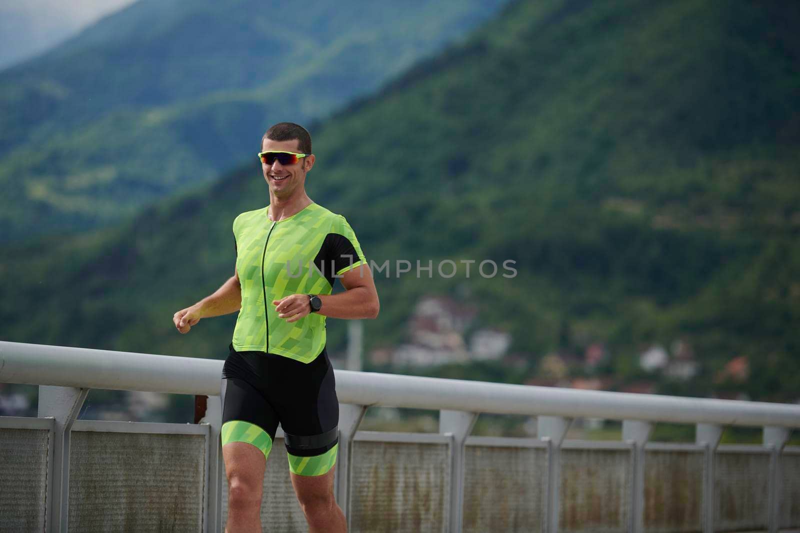 triathlon athlete running on street urban enviroment morning training workout