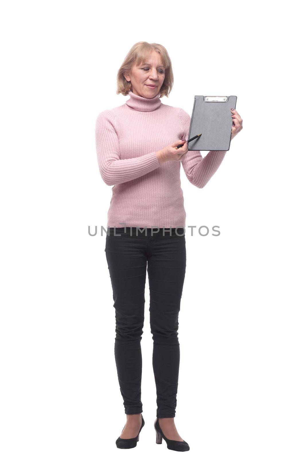 Full length portrait of smiling business woman pointing on blank clipboard isolated over white background