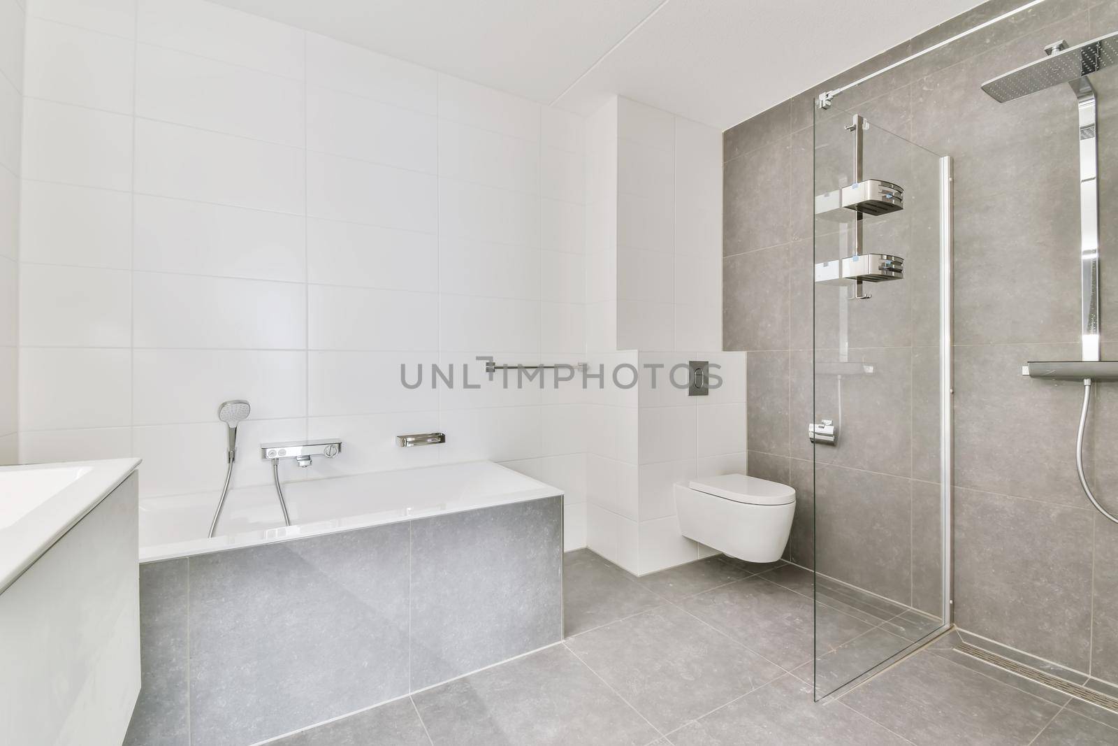 Modern bathroom with gray tiled floor by casamedia
