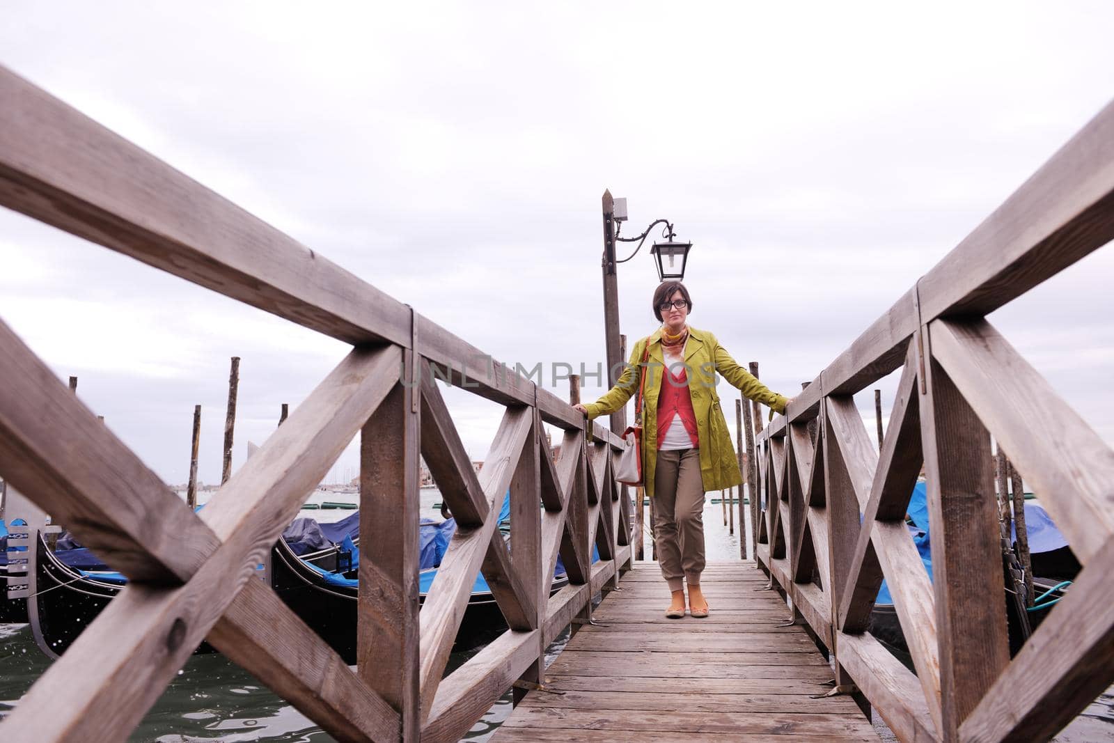 Beautiful tourist woman in Venice, exploring the old city