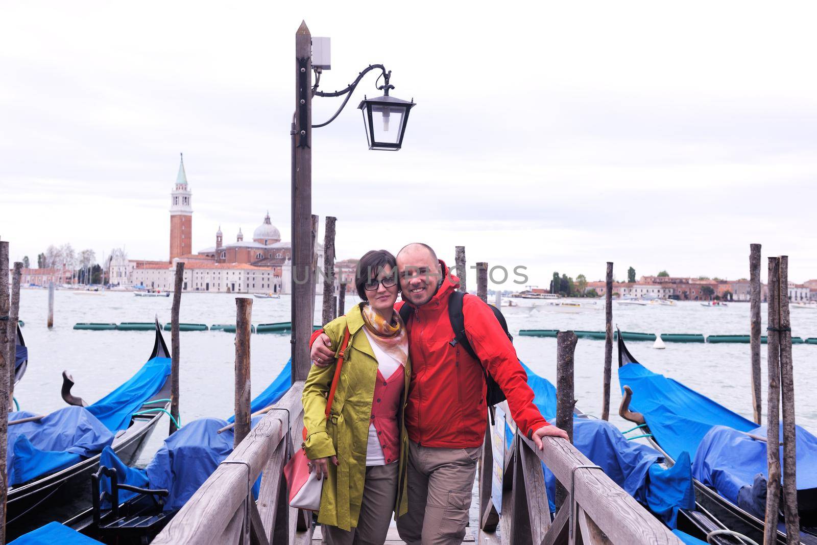 happy young romantic couple in love  travel and have fun in venice