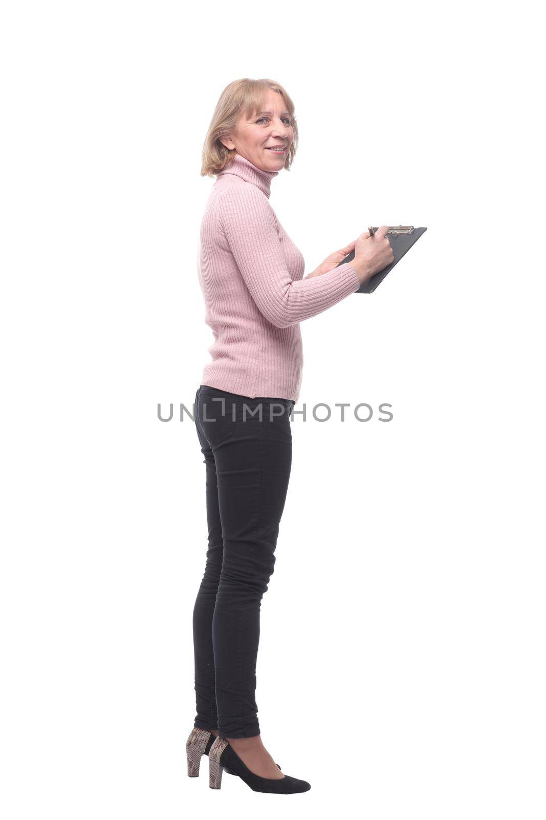 Full length portrait of smiling business woman pointing on blank clipboard isolated over white background