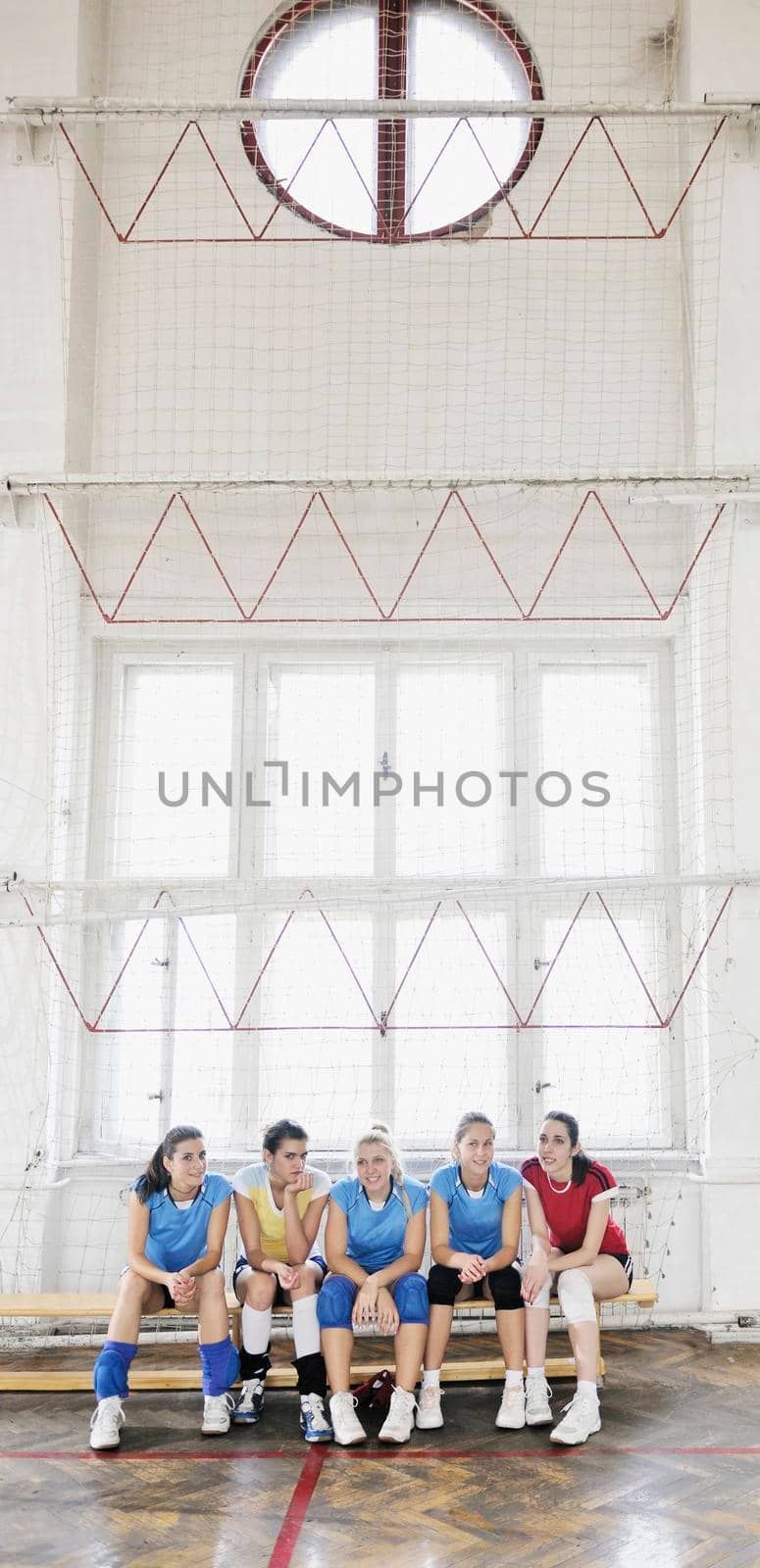 volleyball game sport with group of young beautiful  girls indoor in sport arena