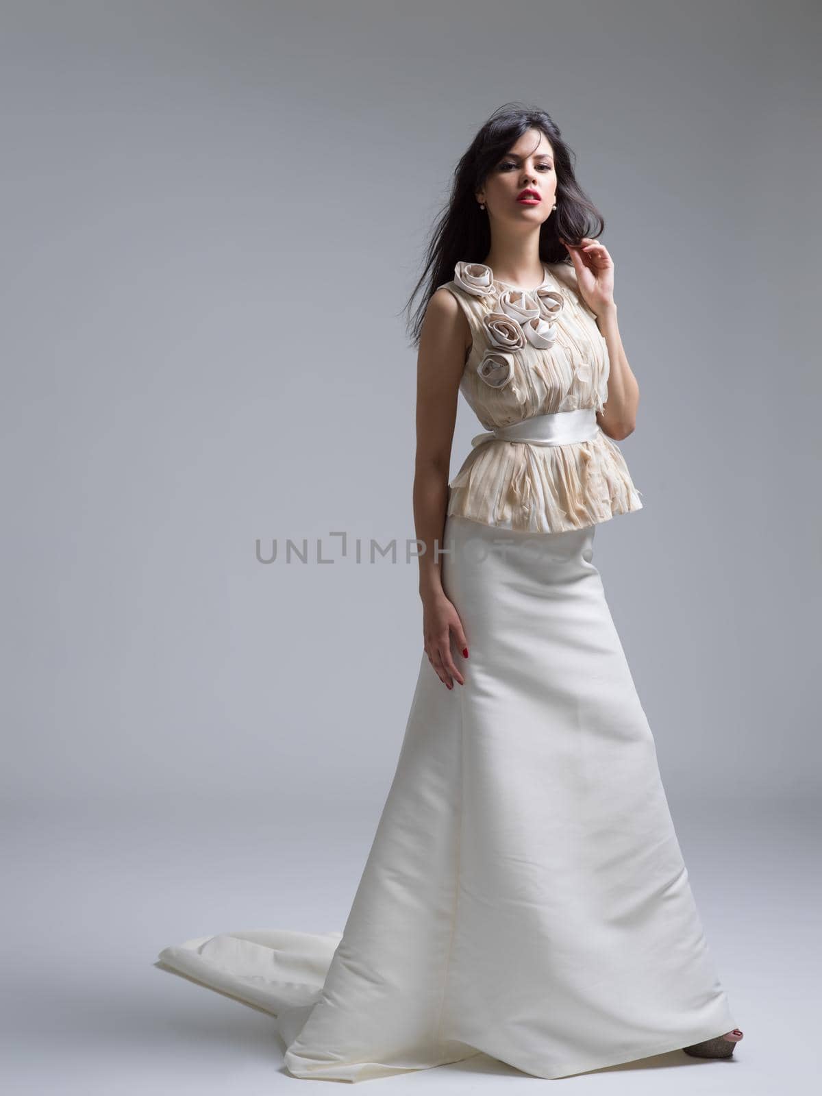 Portrait of beautiful young women in wedding dress isolated on a white background