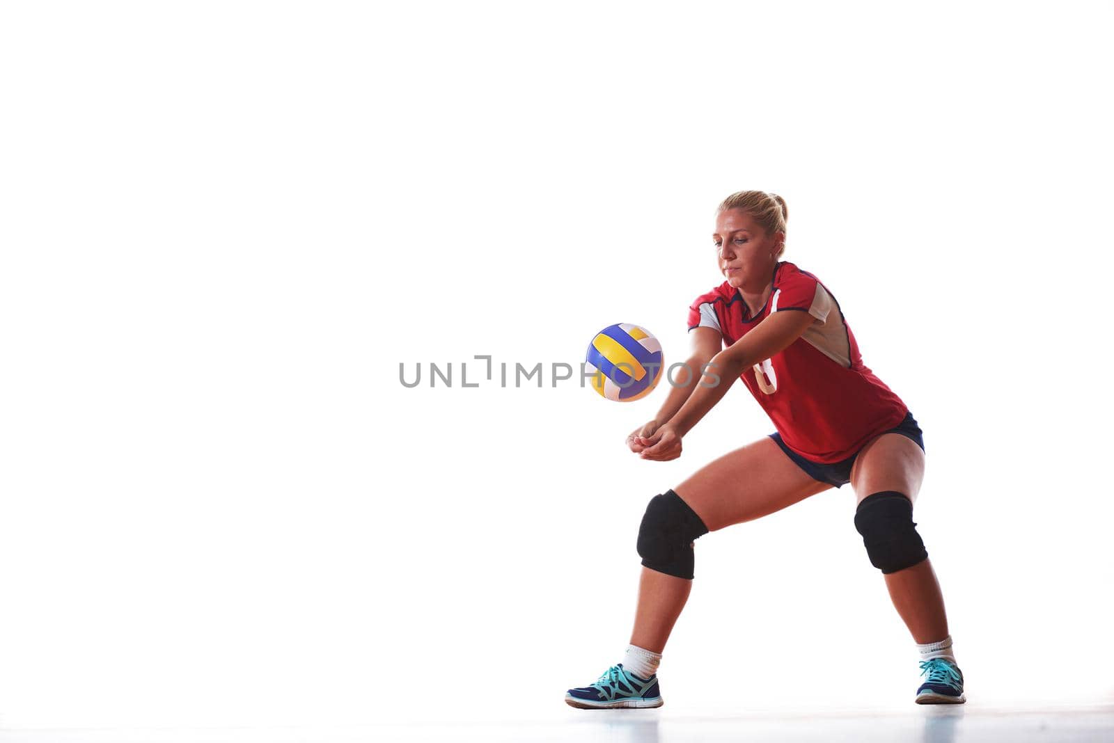 volleyball woman jump and kick ball isolated on white background