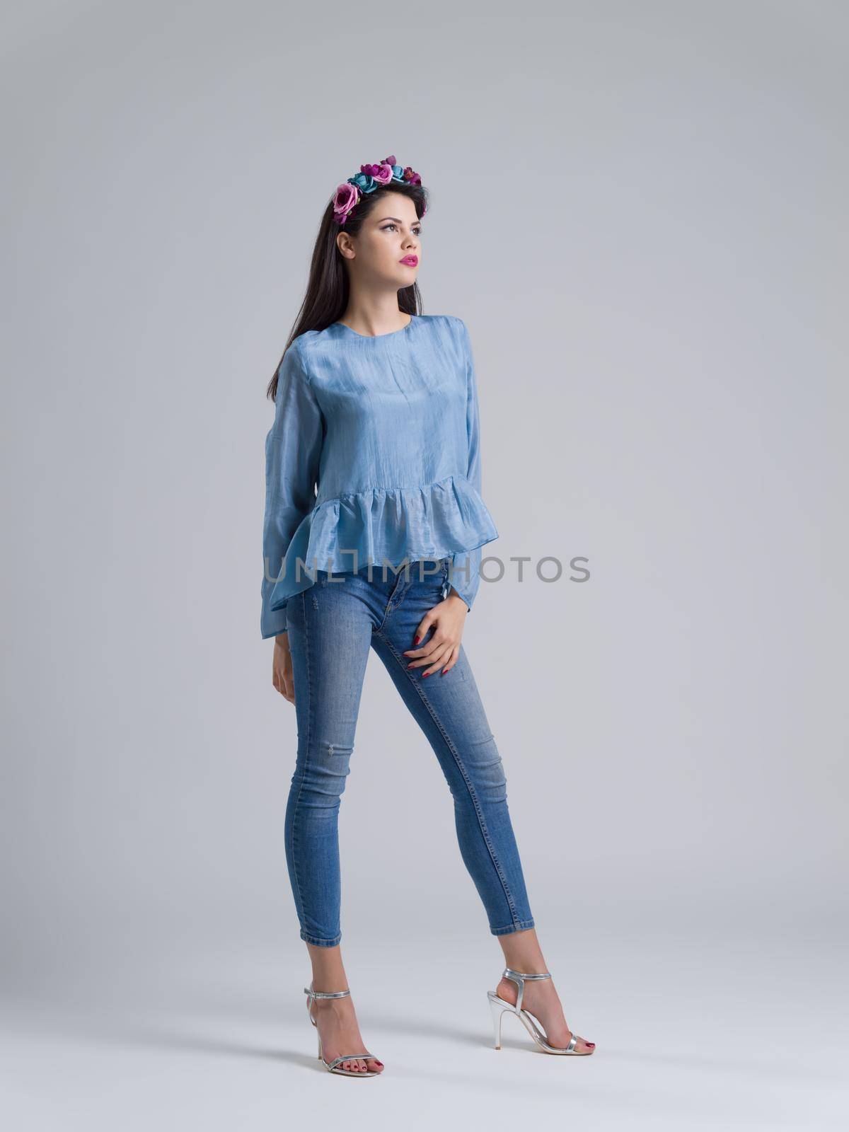 Fashion Model girl isolated over white background. Beauty stylish woman posing in fashionable clothes  Casual style with beauty accessories. High fashion urban style