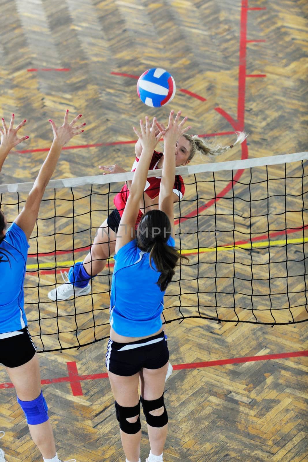 volleyball game sport with group of young beautiful  girls indoor in sport arena