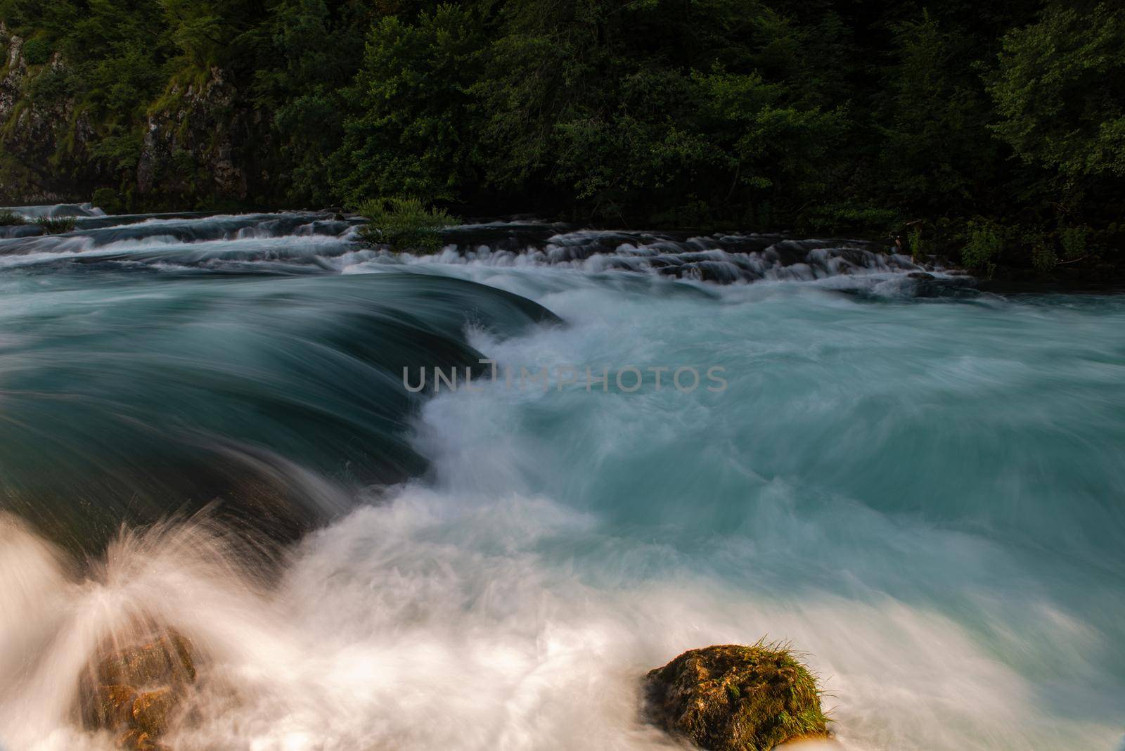 single stone in wild river by dotshock