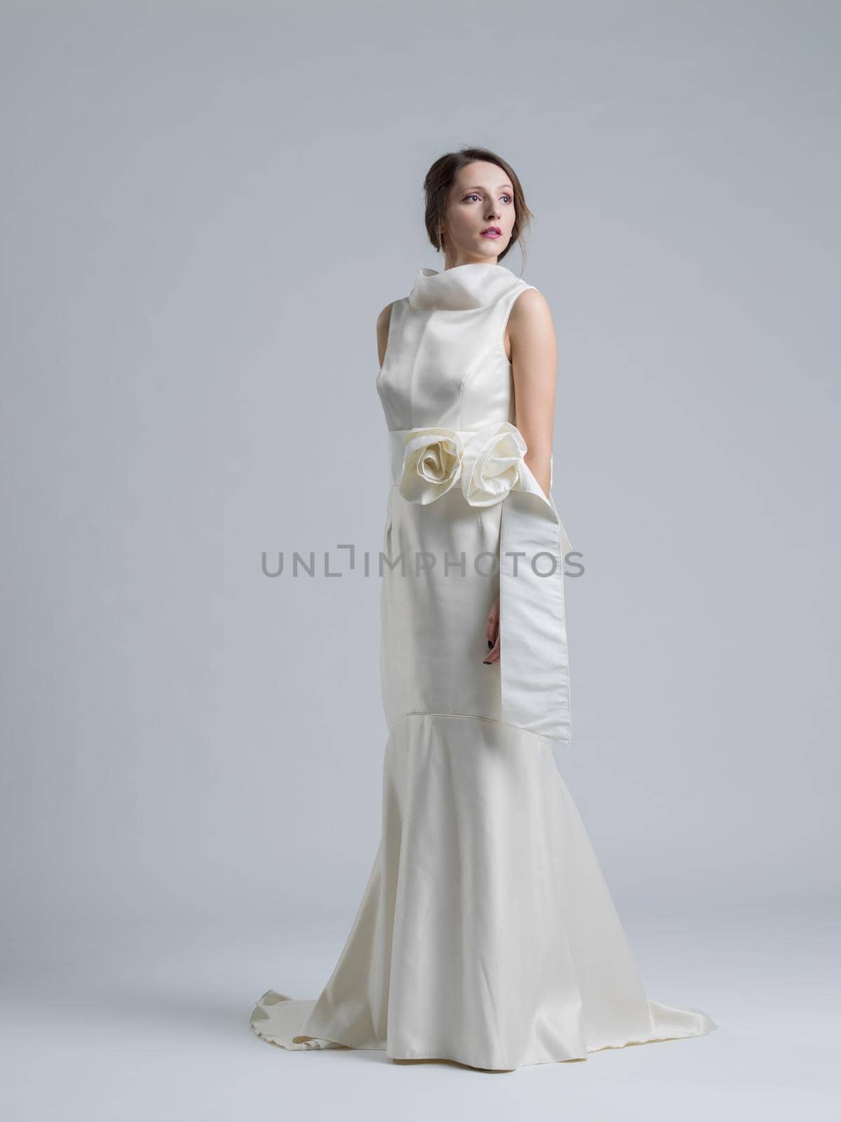 Portrait of beautiful young women in wedding dress isolated on a white background