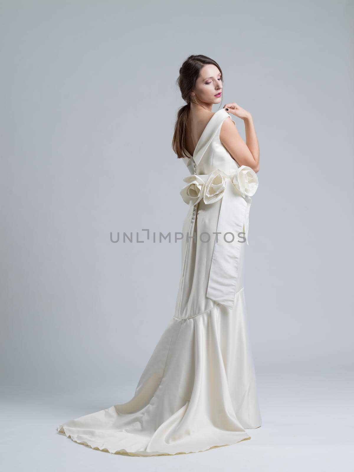 Portrait of beautiful young women in wedding dress isolated on a white background