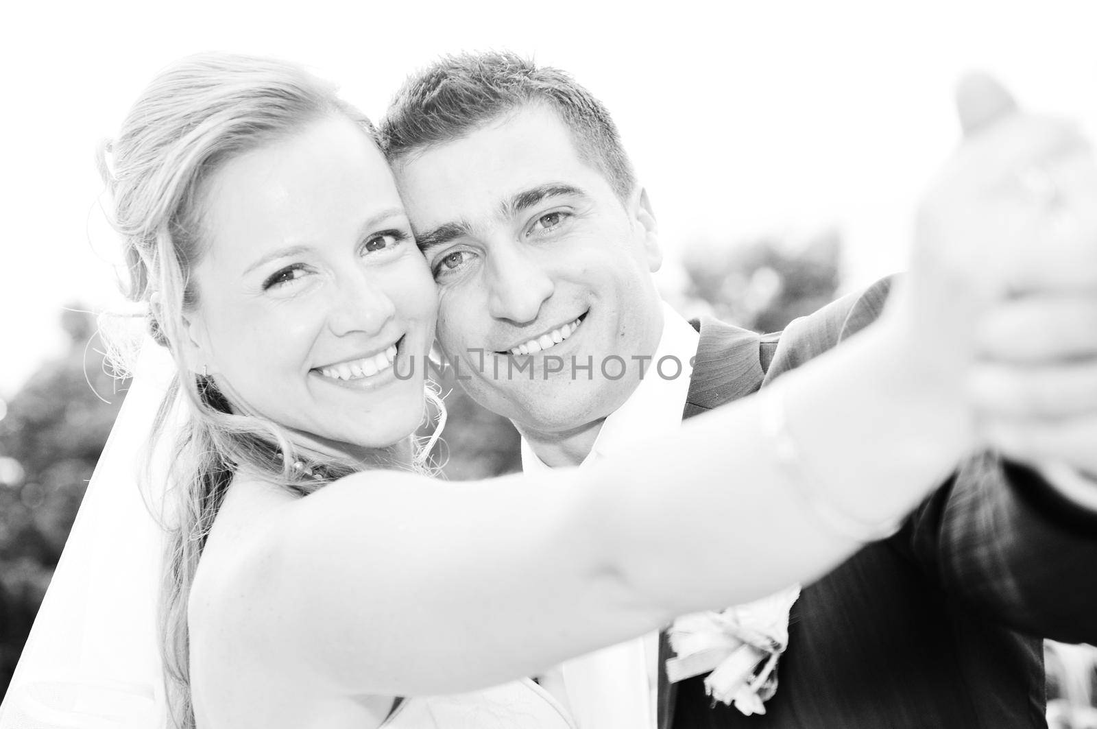 happy young and beautiful bride and groom at wedding party  outdoor