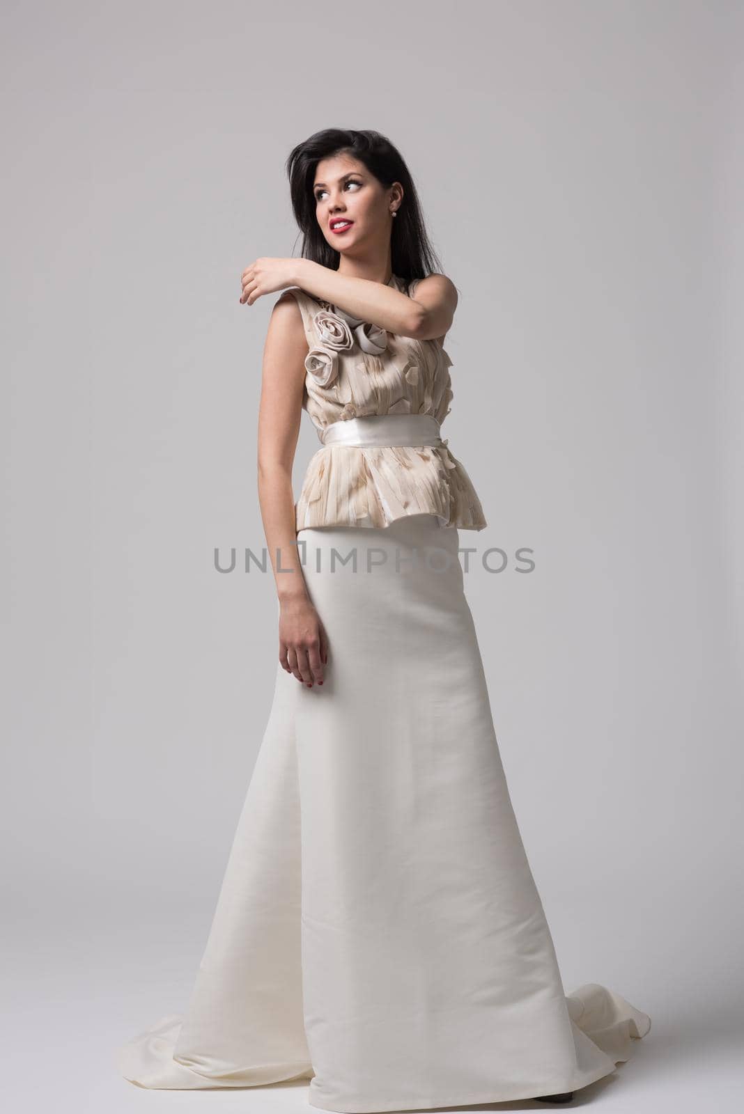 Portrait of beautiful young women in wedding dress isolated on a white background