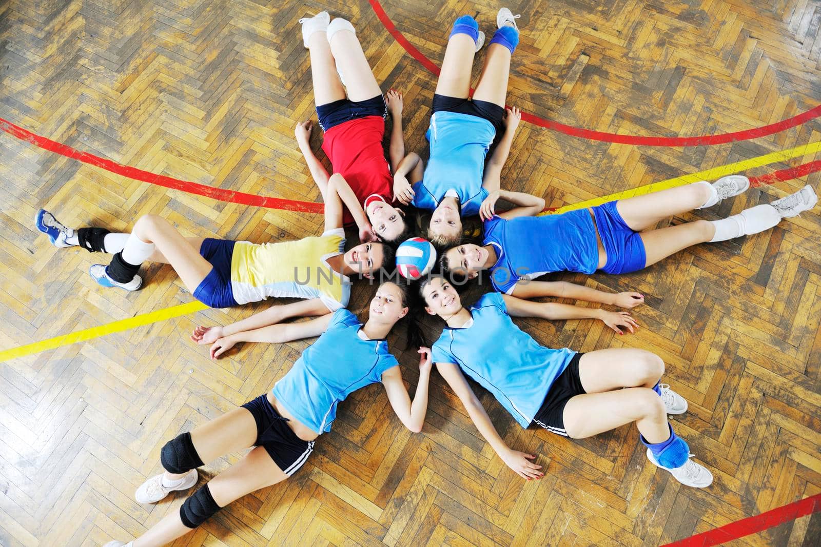 volleyball game sport with group of young beautiful  girls indoor in sport arena