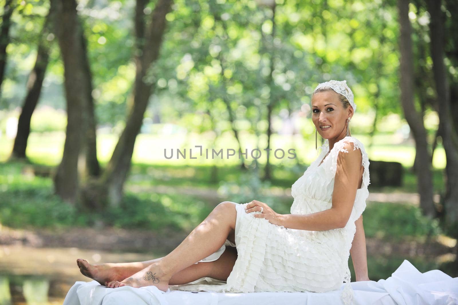 beautiful bride woman people in fashion wedding dress posing outdoor in bright park