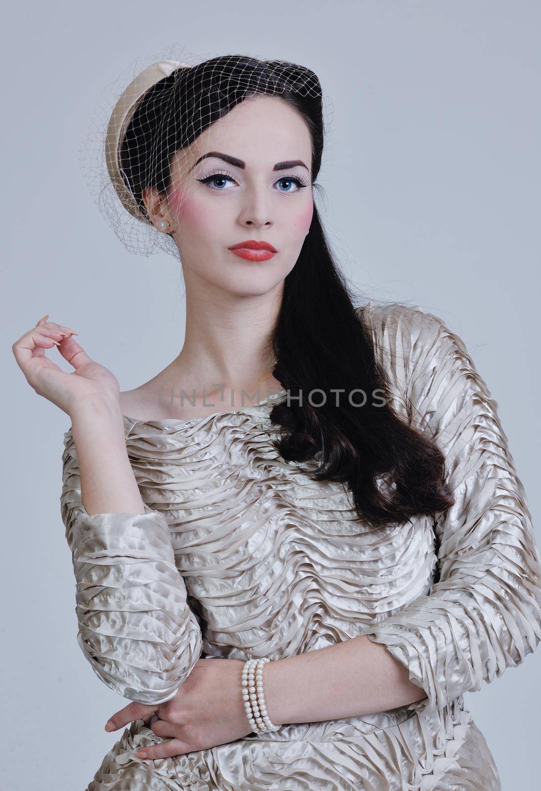 beautiful young bride wearing  wedding dress in retro fashion style isolated on white background in studio