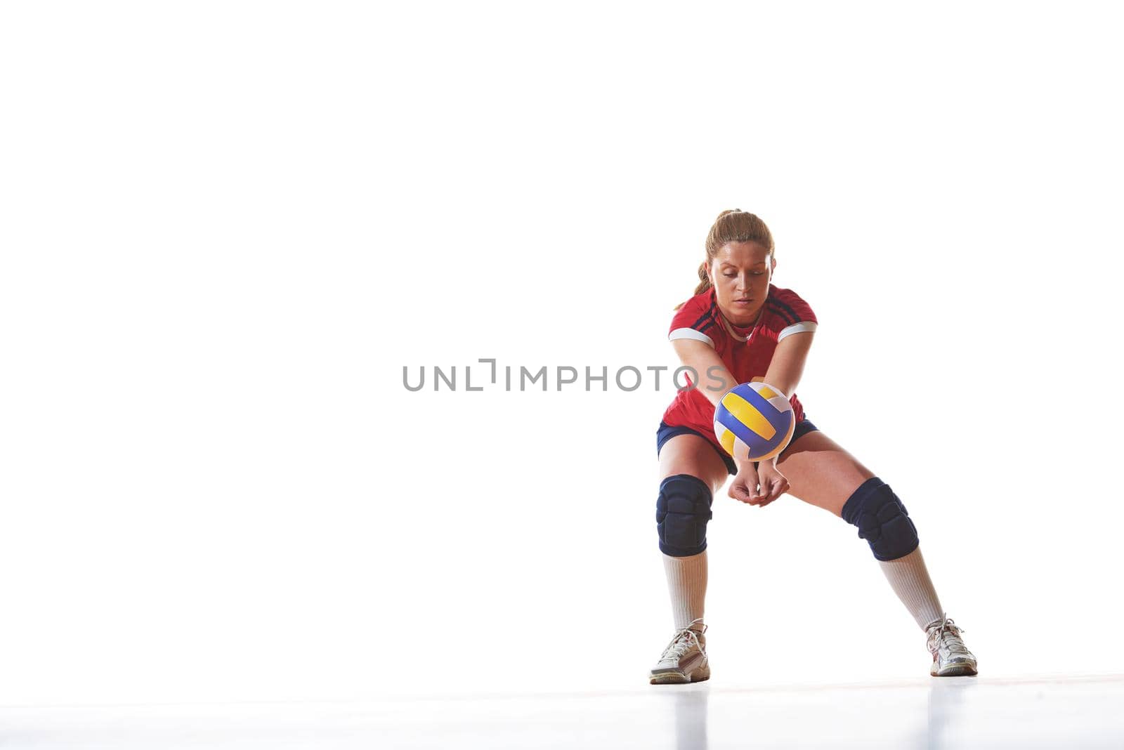 volleyball woman jump and kick ball isolated on white background