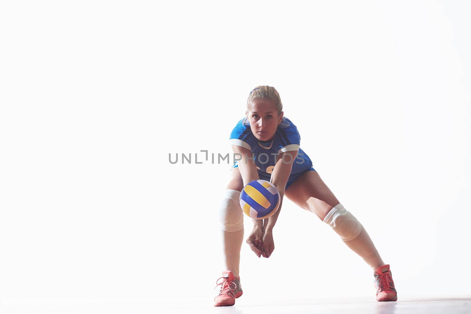 volleyball woman jump and kick ball isolated on white background