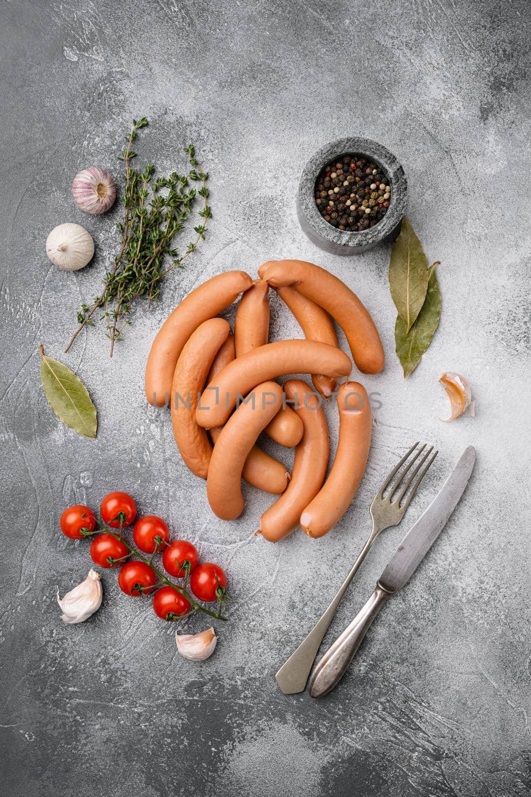 Raw pork and beef mix sausage set, on gray stone table background, top view flat lay
