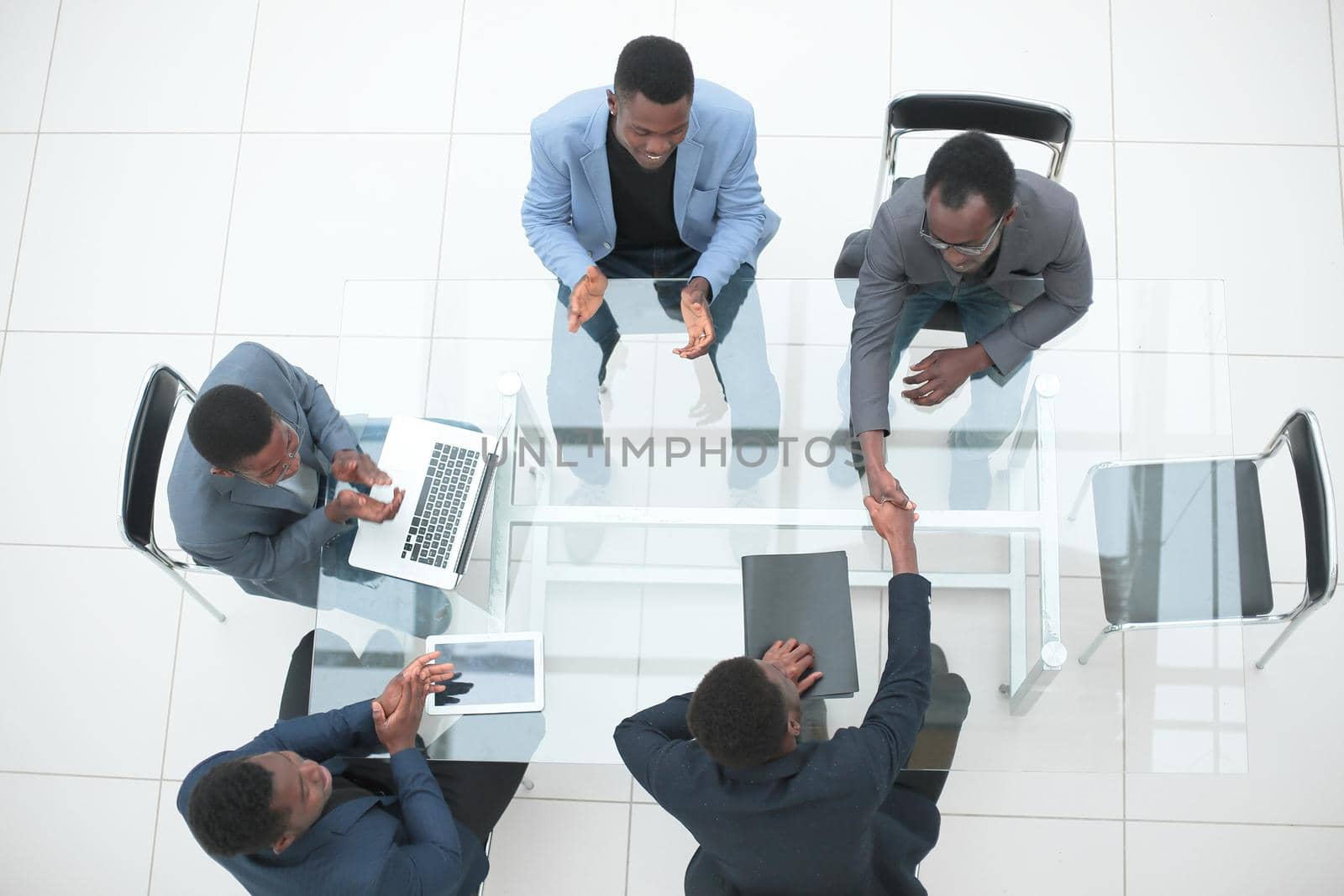 top view. business handshake at an office meeting. the concept of cooperation