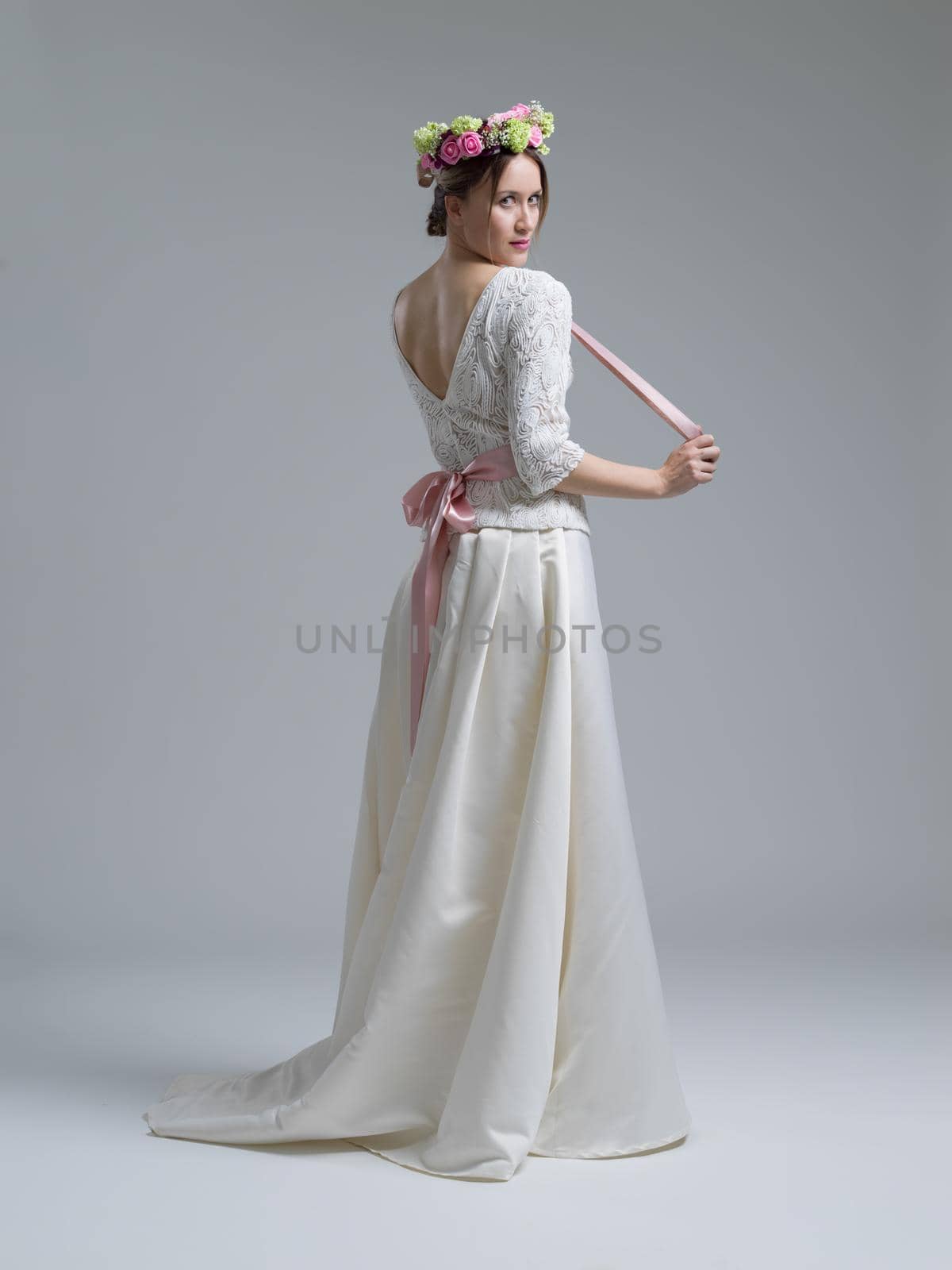 Portrait of beautiful young women in wedding dress isolated on a white background