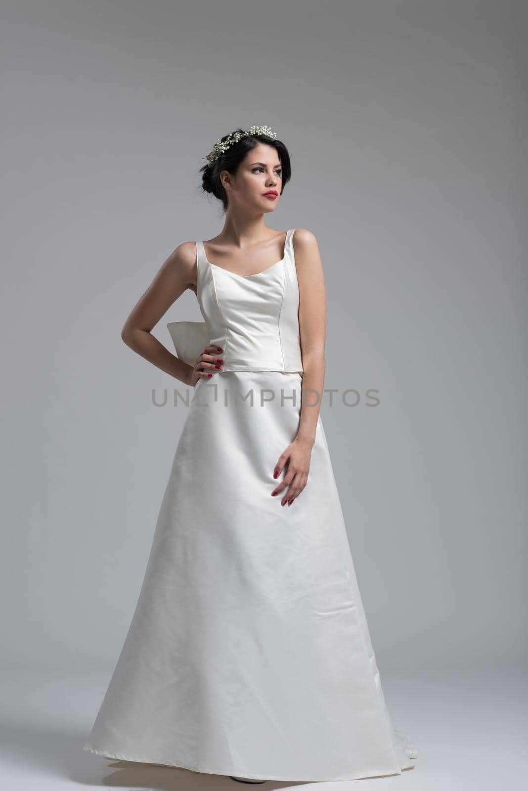 Portrait of beautiful young women in wedding dress isolated on a white background