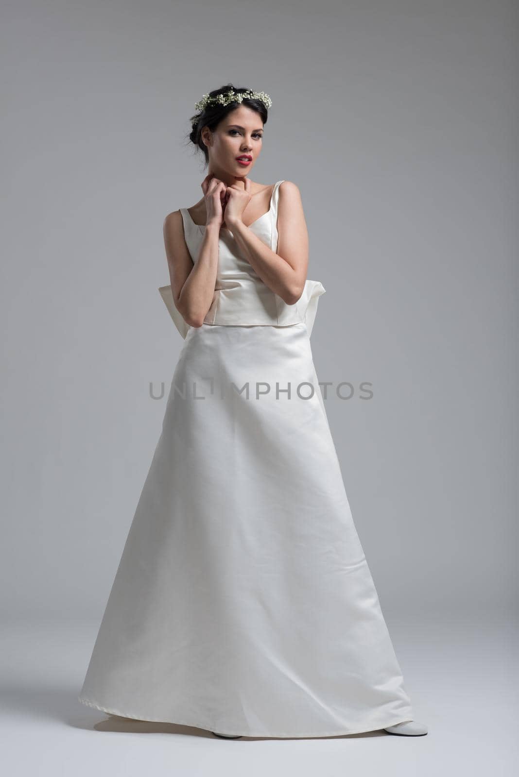 Portrait of beautiful young women in wedding dress isolated on a white background