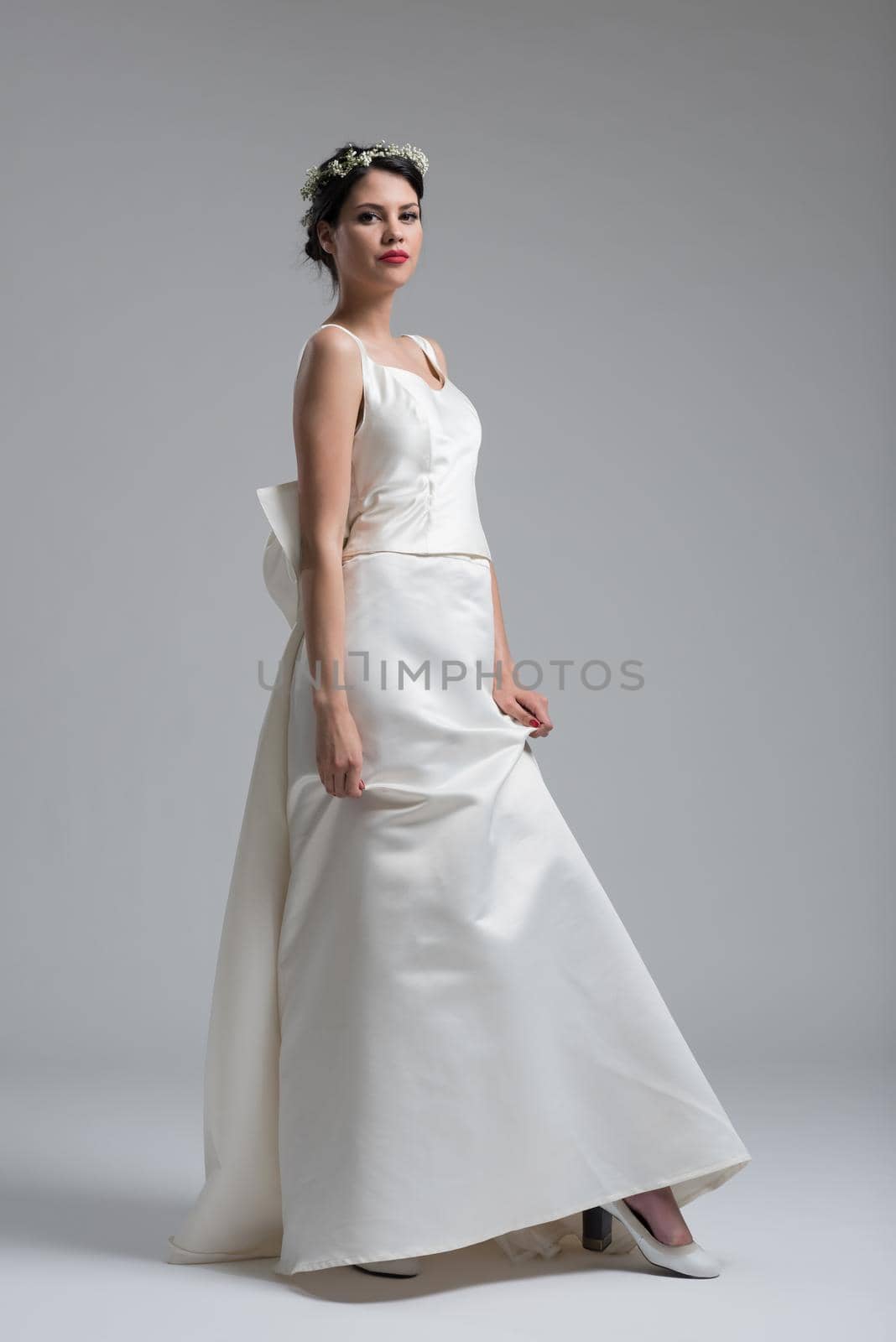 Portrait of beautiful young women in wedding dress by dotshock