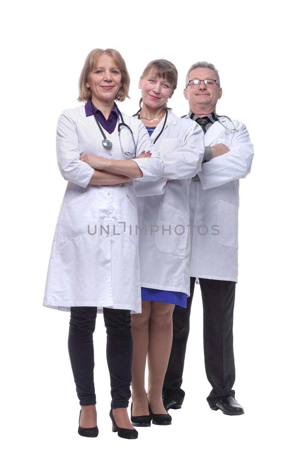 Portrait of group of smiling hospital colleagues standing together isolated over white background
