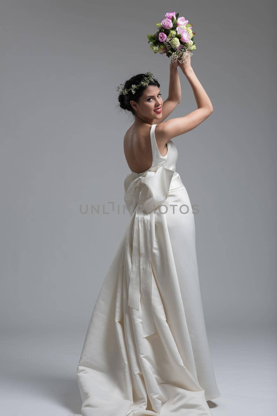 bride with a bouquet  isolated on white background by dotshock