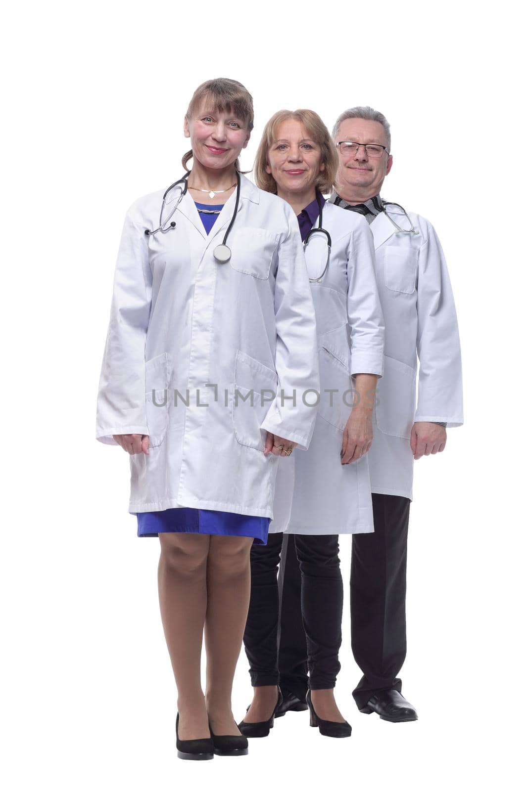 Portrait of group of smiling hospital colleagues standing together isolated over white background