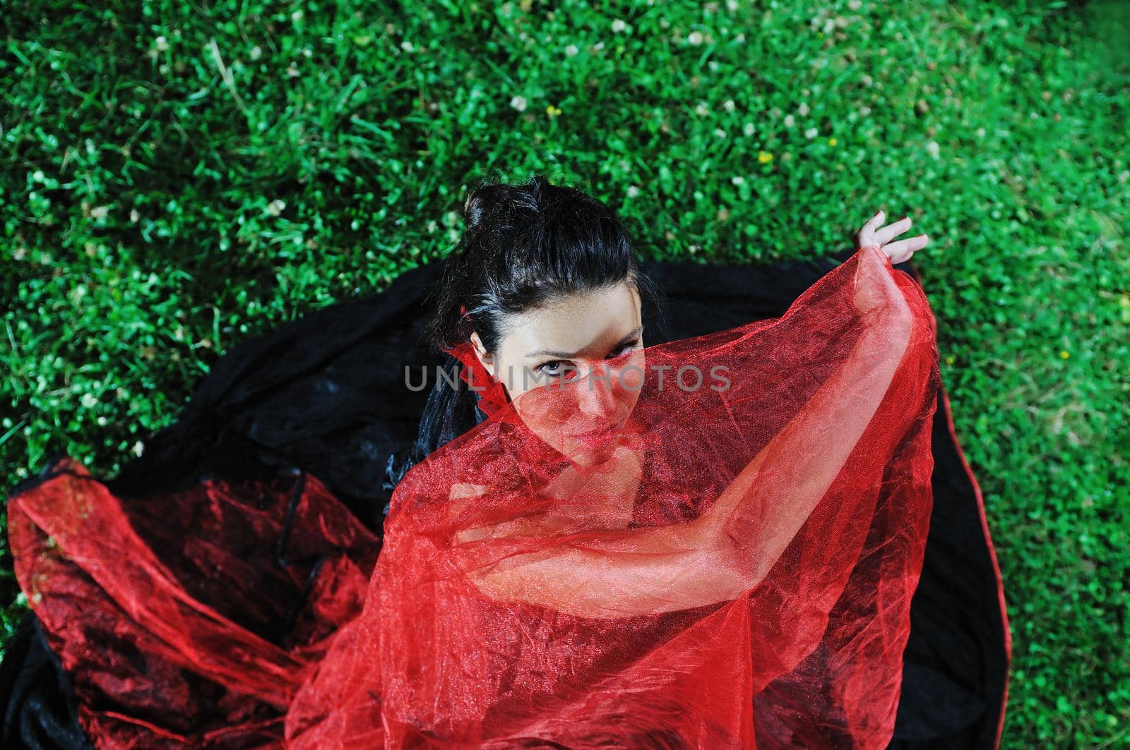 young beautiful bride in black wedding dress in dar at night 