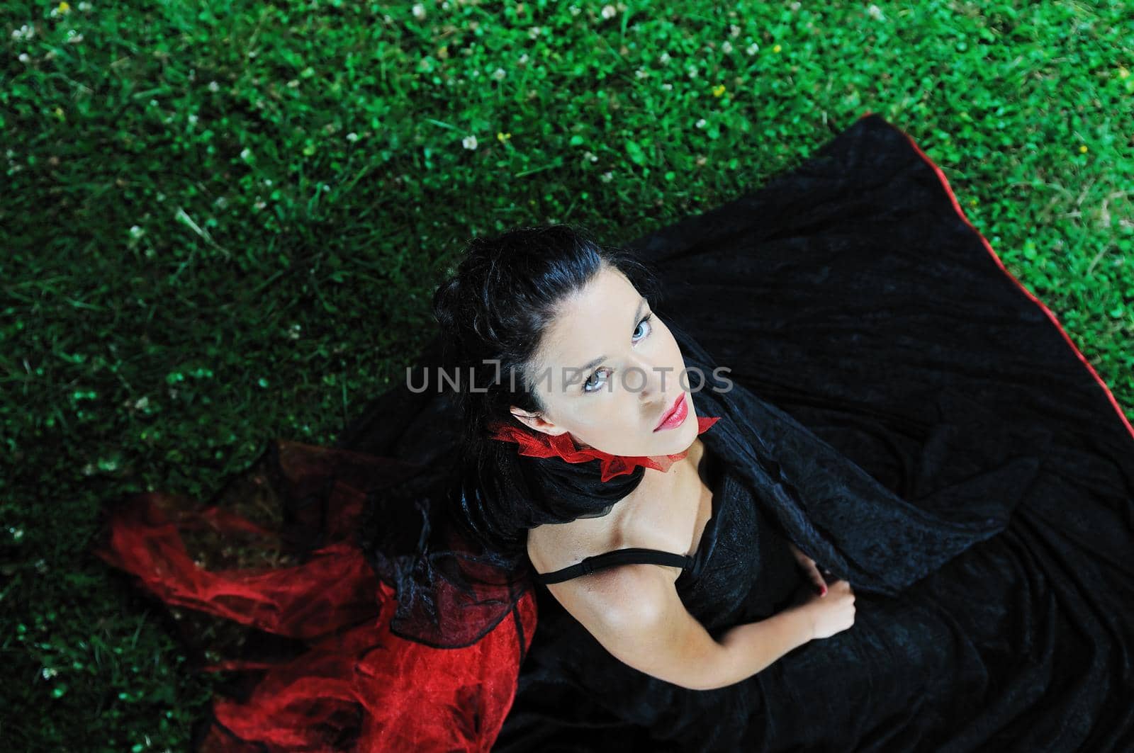 young beautiful bride in black wedding dress in dar at night 