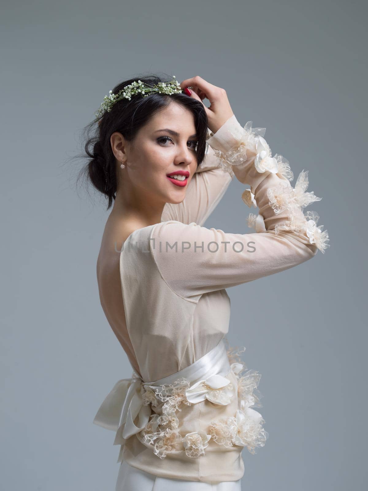 Portrait of beautiful young women in wedding dress isolated on a white background