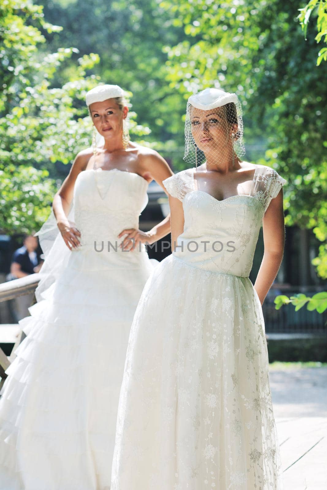 beautiful bride woman people in fashion wedding dress posing outdoor in bright park