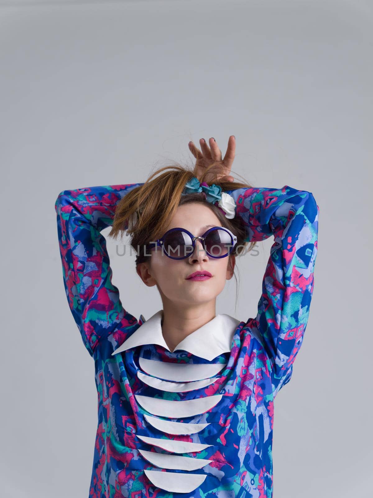 woman posing in fashionable clothes and sunglasses by dotshock
